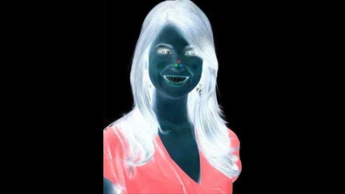 Optical illusion girl with red dot on nose